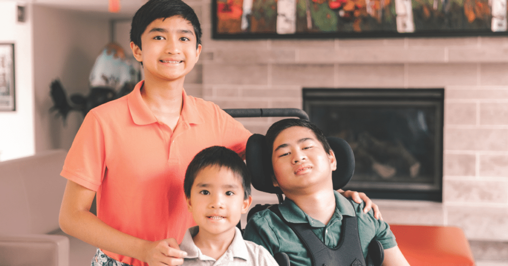 Three boys in front of a fireplace