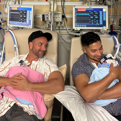 Two men holding babies